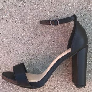 Black open toed 3 inch heels.